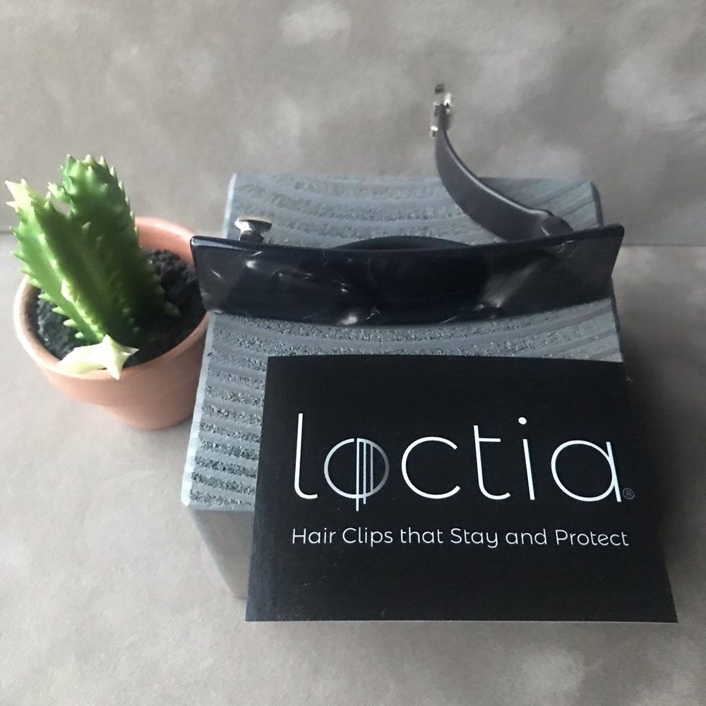 Barrette Hair Clip lined by Loctia with a black liner.